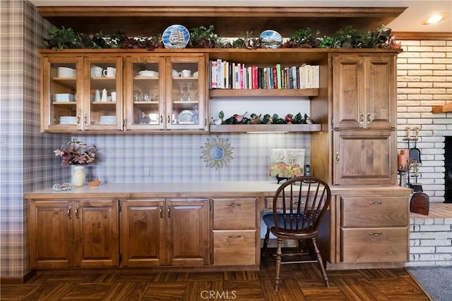 bar with built in desk and dark parquet flooring