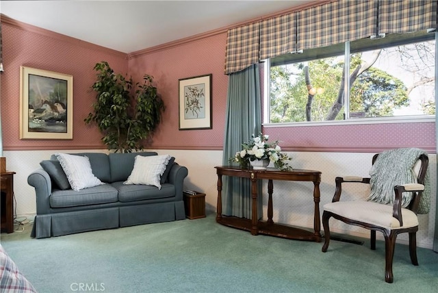 sitting room featuring carpet floors and crown molding