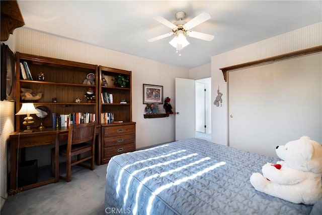 bedroom featuring ceiling fan and light colored carpet