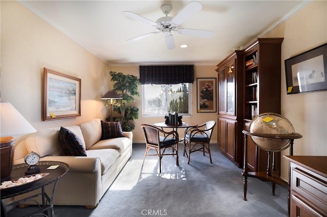 dining room with ceiling fan, carpet, and crown molding