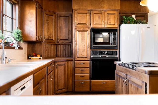 kitchen featuring sink and black appliances