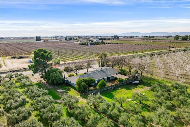 drone / aerial view featuring a rural view and a mountain view