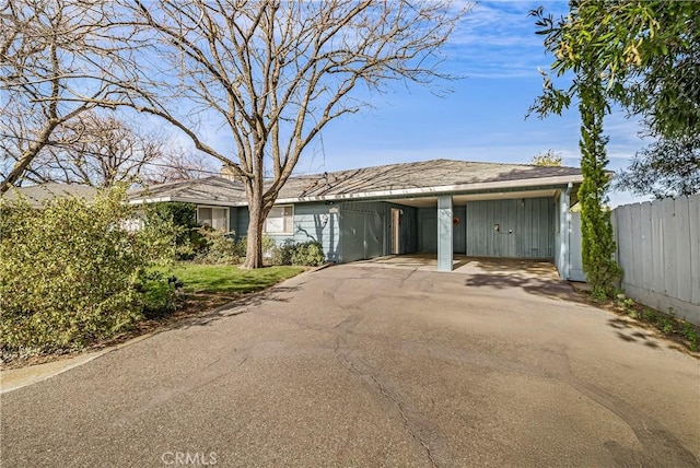 ranch-style house with a carport