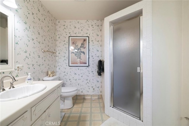 bathroom featuring toilet, walk in shower, and vanity