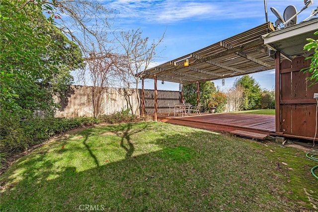 view of yard with a pergola and a deck