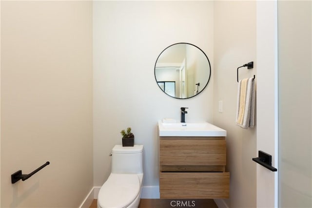 bathroom with toilet and vanity