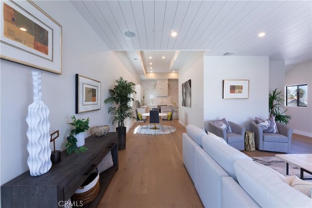 living room featuring wooden ceiling and hardwood / wood-style floors