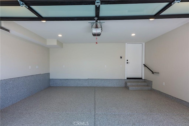 garage featuring a garage door opener