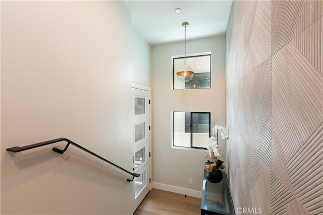 stairs with hardwood / wood-style floors