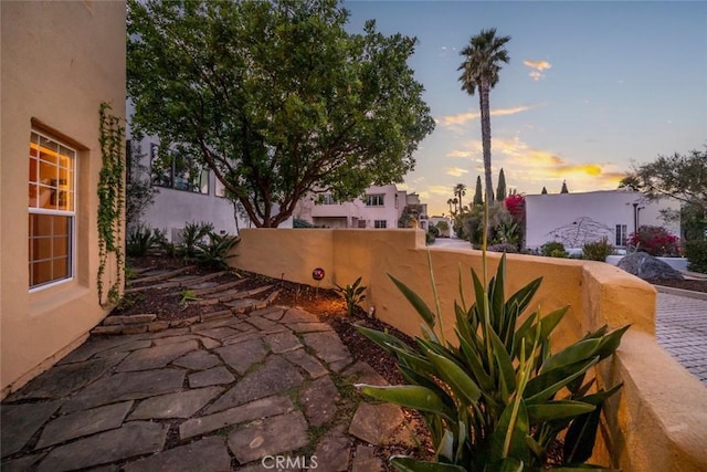 view of patio terrace at dusk