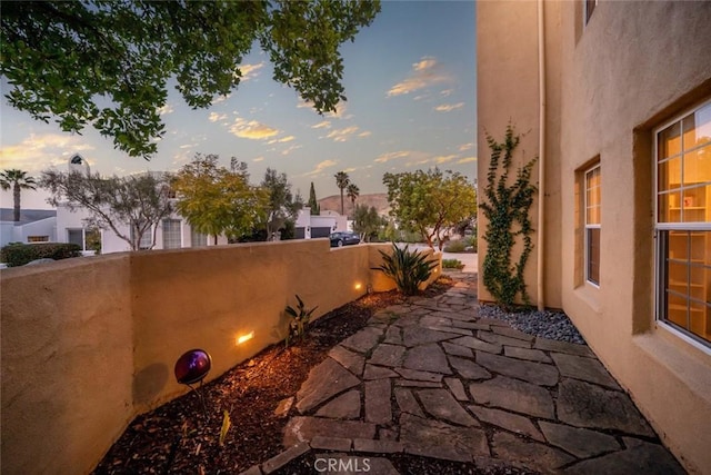 view of patio terrace at dusk