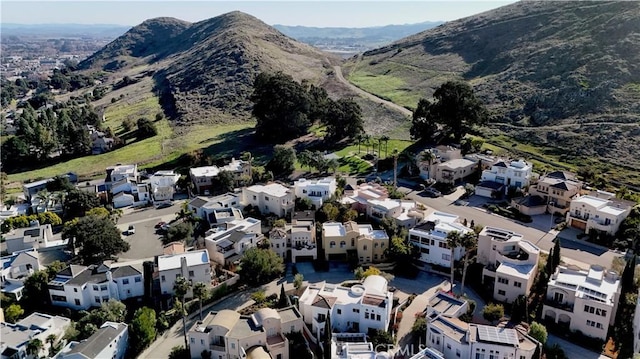 birds eye view of property featuring a mountain view