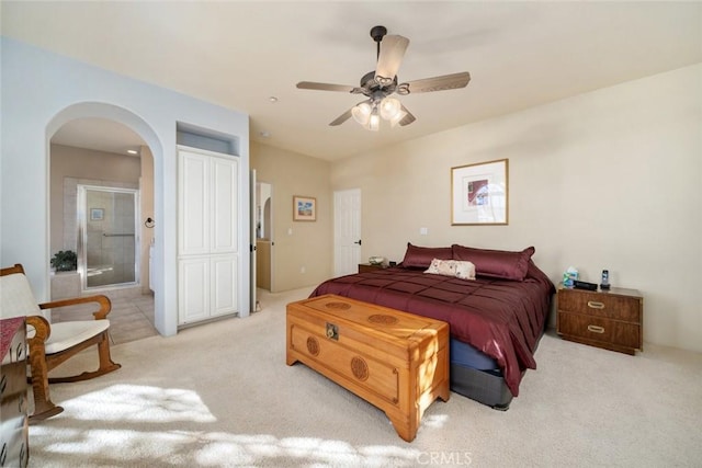 bedroom featuring ceiling fan and light carpet