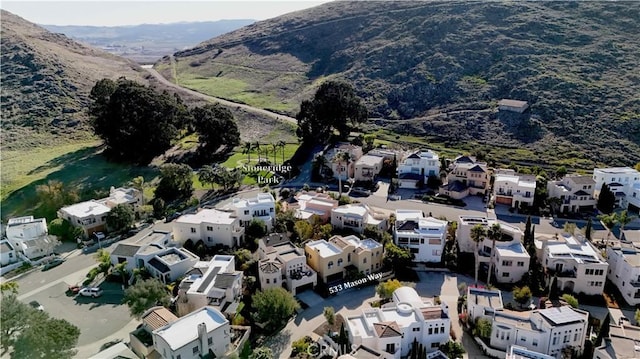 drone / aerial view featuring a mountain view