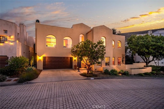 adobe home featuring a garage