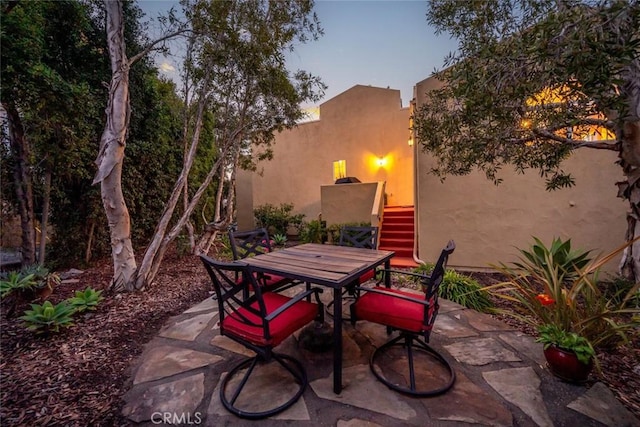 view of patio terrace at dusk