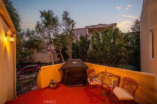 patio terrace at dusk with a grill