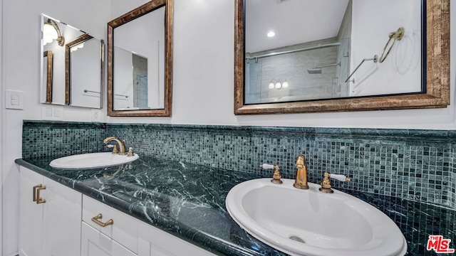 bathroom featuring walk in shower and vanity