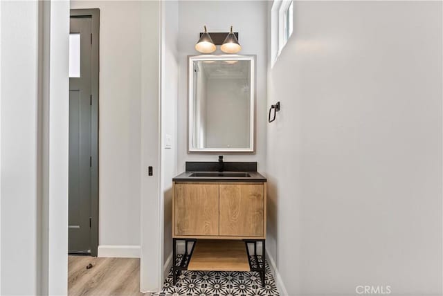 bathroom featuring hardwood / wood-style flooring and vanity