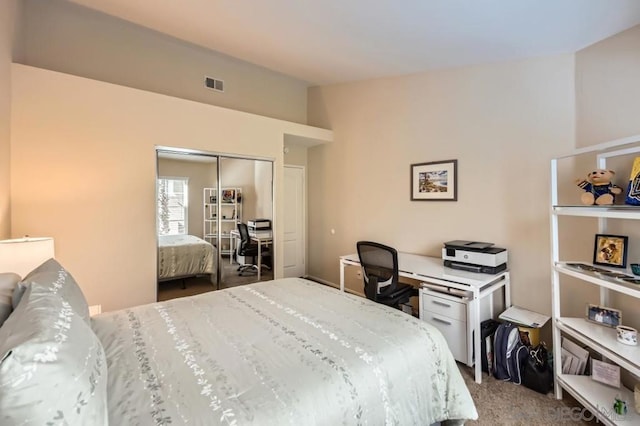 bedroom featuring lofted ceiling, carpet floors, and a closet