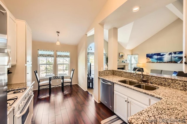 kitchen featuring sink, white cabinetry, light stone counters, hanging light fixtures, and dishwasher