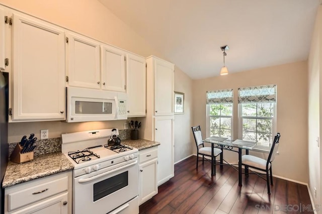 kitchen with white cabinetry, white appliances, hanging light fixtures, and light stone counters