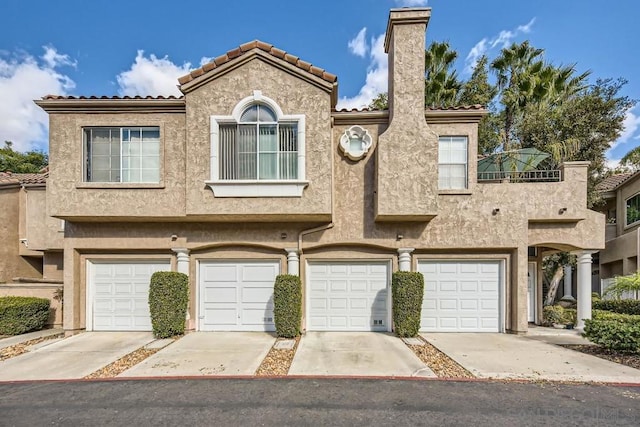 townhome / multi-family property featuring a garage