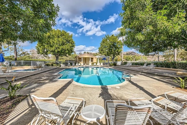 view of swimming pool featuring a patio area