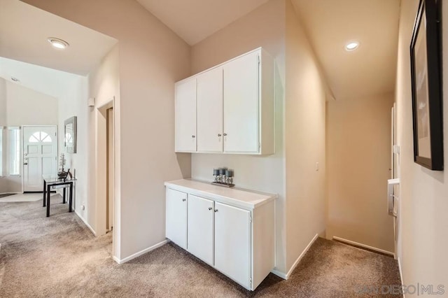 interior space featuring light colored carpet