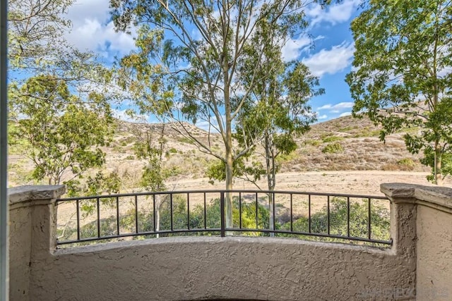 balcony featuring a mountain view