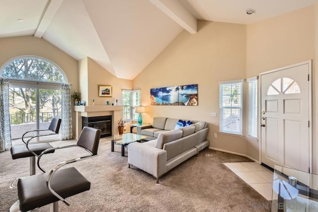 living room featuring beamed ceiling, high vaulted ceiling, and light carpet