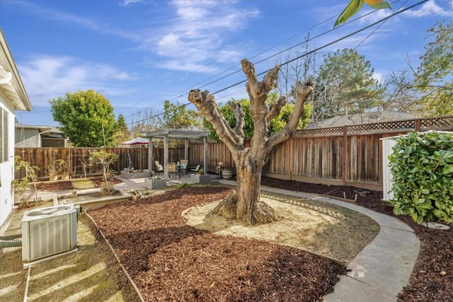 view of yard with a patio area, central air condition unit, and a pergola