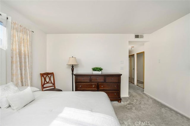 bedroom featuring light colored carpet