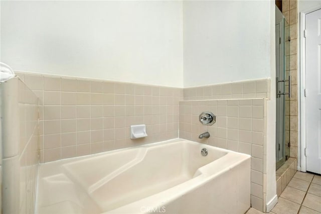 bathroom featuring a tub and tile patterned floors