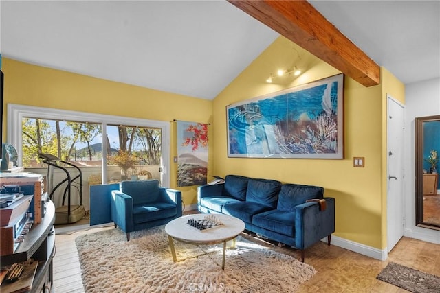 living room with lofted ceiling with beams