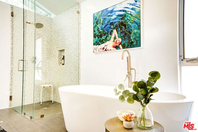 bathroom with lofted ceiling and separate shower and tub