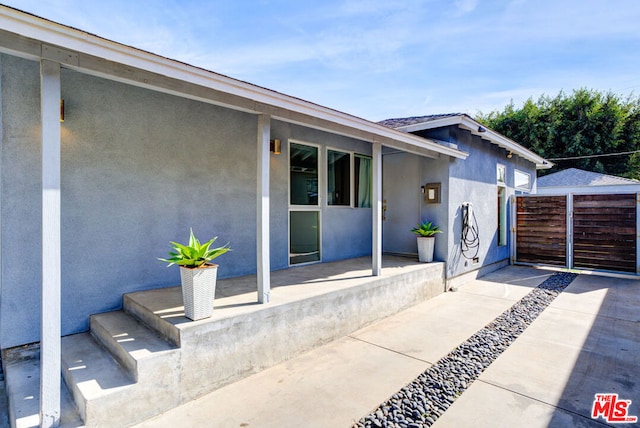 entrance to property with a patio