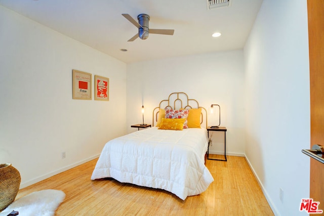 bedroom with wood-type flooring and ceiling fan