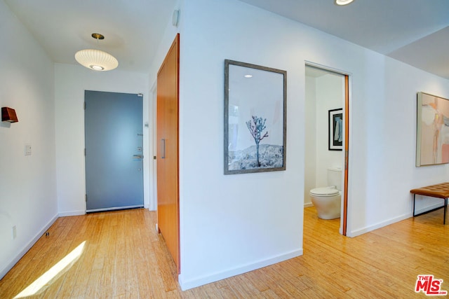 corridor featuring light hardwood / wood-style flooring