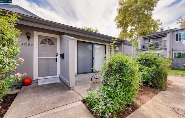 doorway to property with a patio area and a balcony