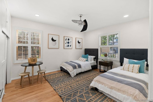 bedroom with ceiling fan and hardwood / wood-style floors