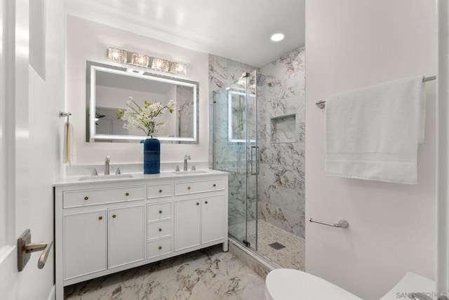 bathroom with walk in shower, vanity, and toilet