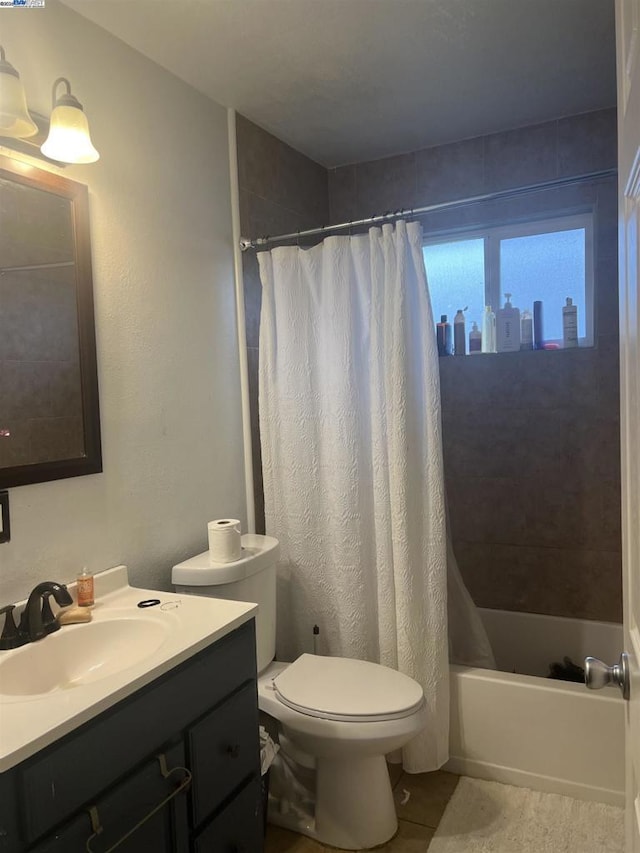 full bathroom with toilet, vanity, shower / bath combo, and tile patterned floors