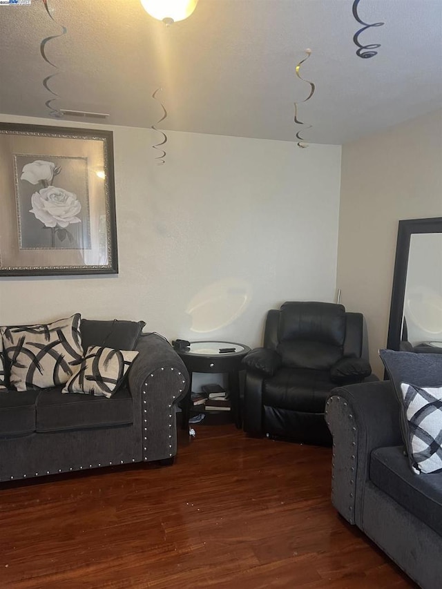 living room with dark hardwood / wood-style floors