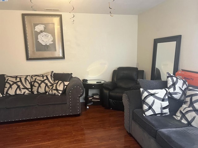 living room featuring dark wood-type flooring