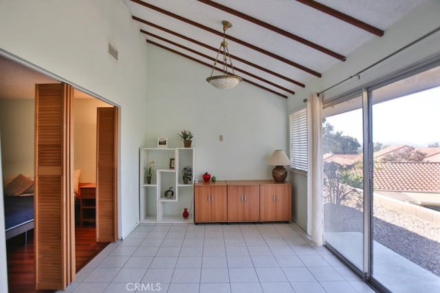 sunroom with vaulted ceiling with beams and visible vents