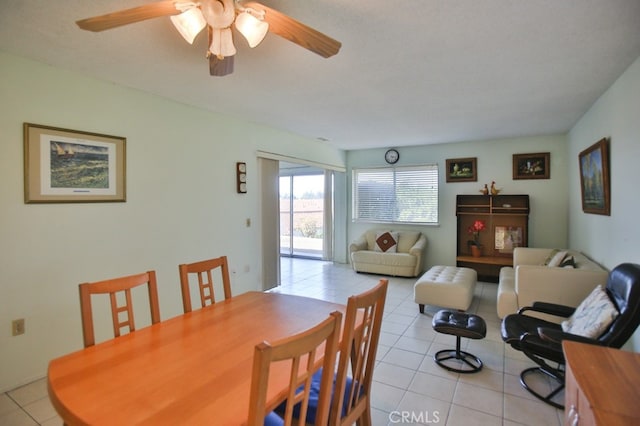 dining room featuring light tile patterned floors and a ceiling fan