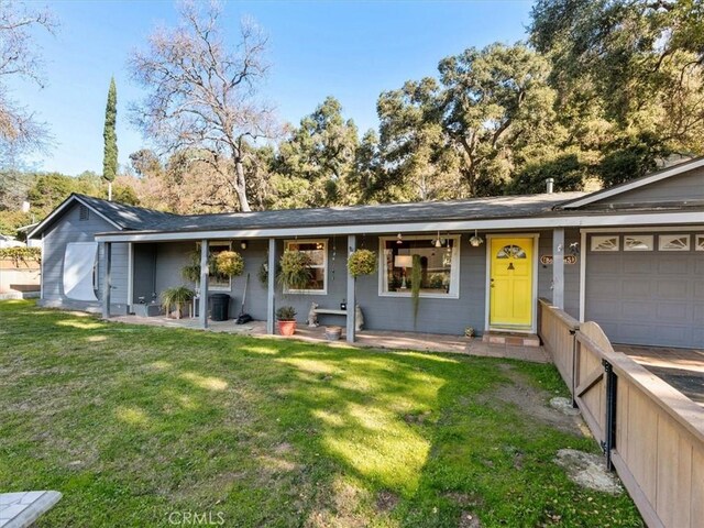 view of front of home with a garage and a front yard