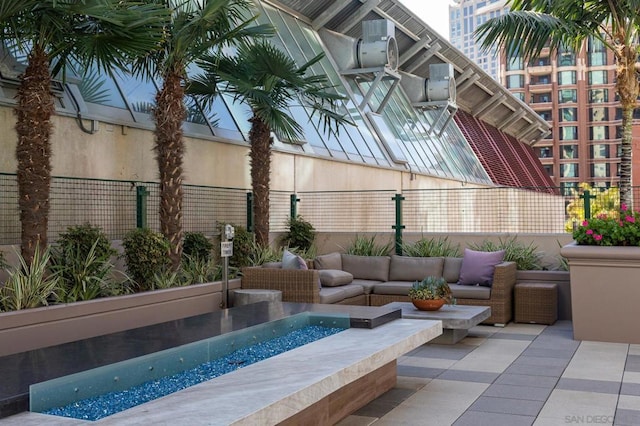 view of swimming pool with an outdoor living space and a patio