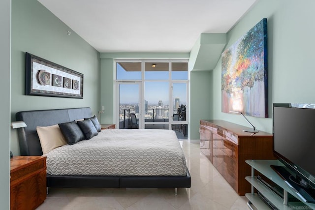 tiled bedroom featuring floor to ceiling windows